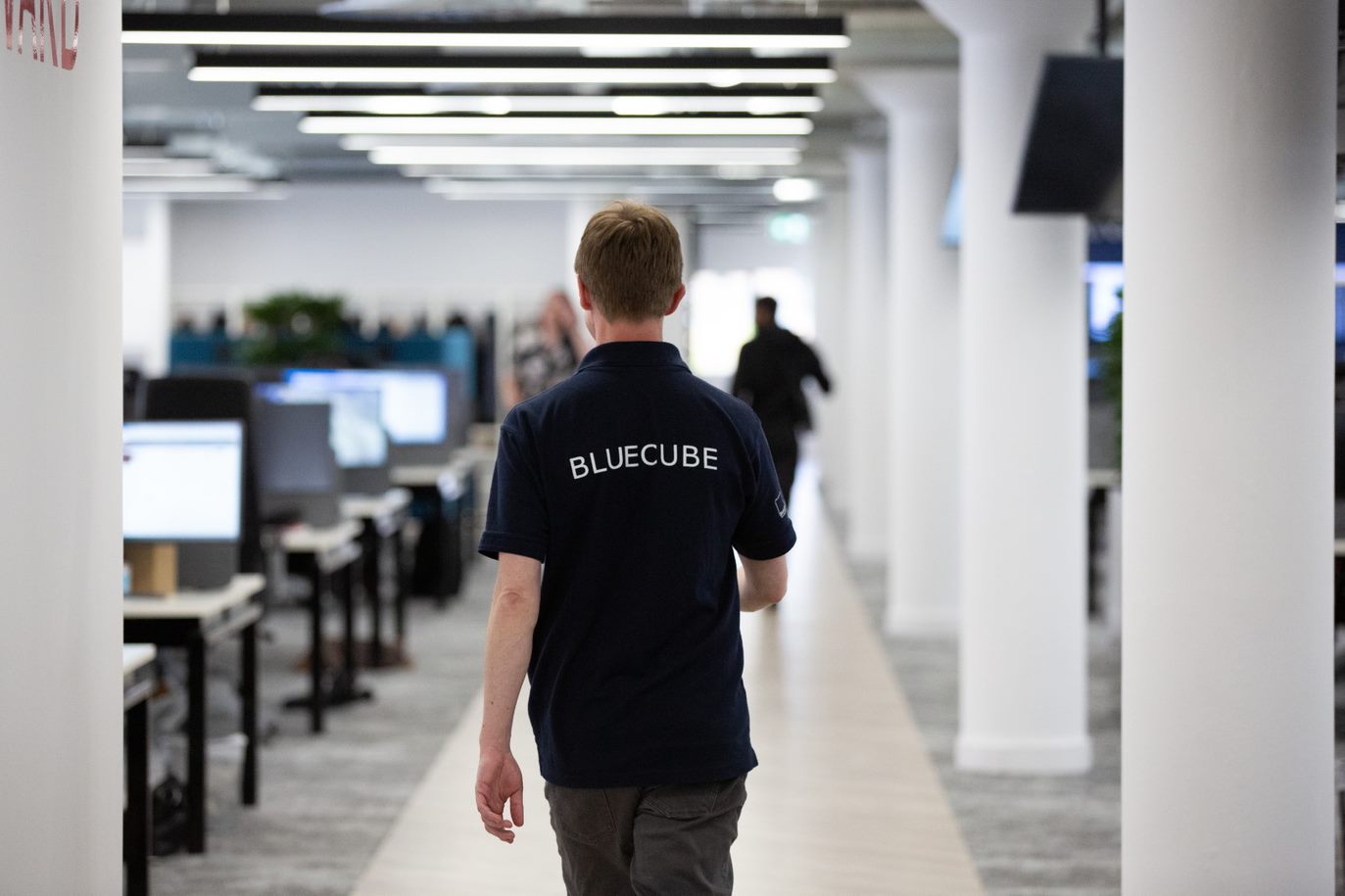 bluecube engineer walking to the it service desk